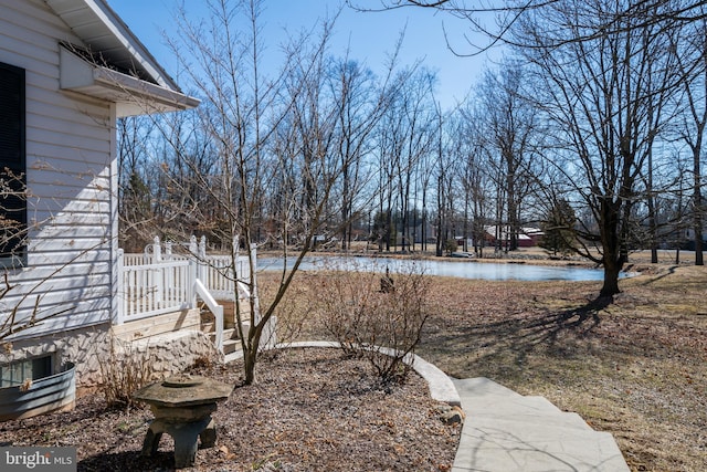 view of yard with a water view