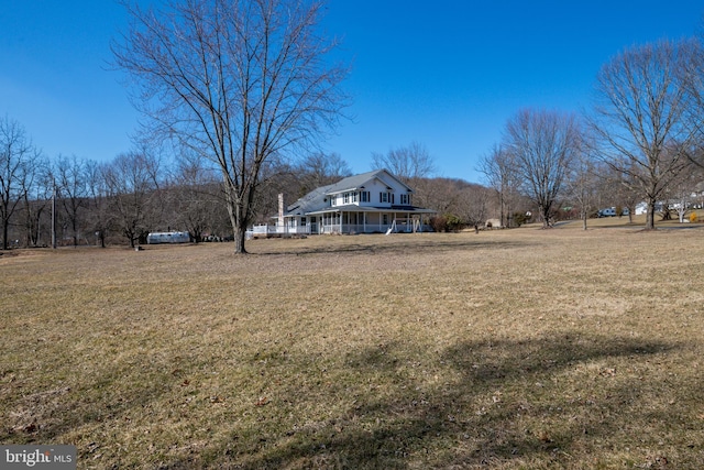 view of yard with a porch