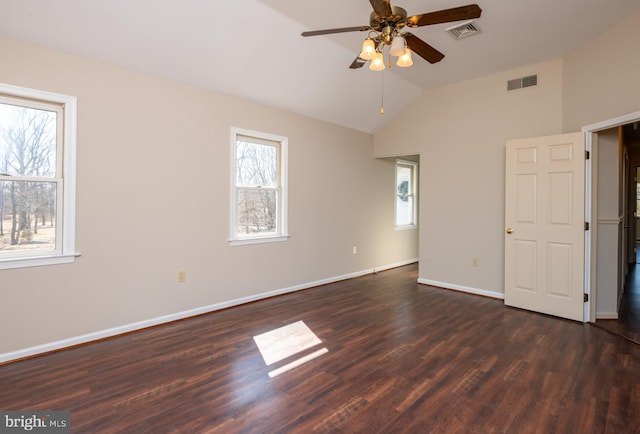 unfurnished bedroom featuring visible vents, baseboards, dark wood-style flooring, and vaulted ceiling