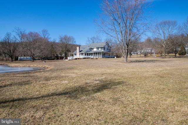 view of yard with covered porch