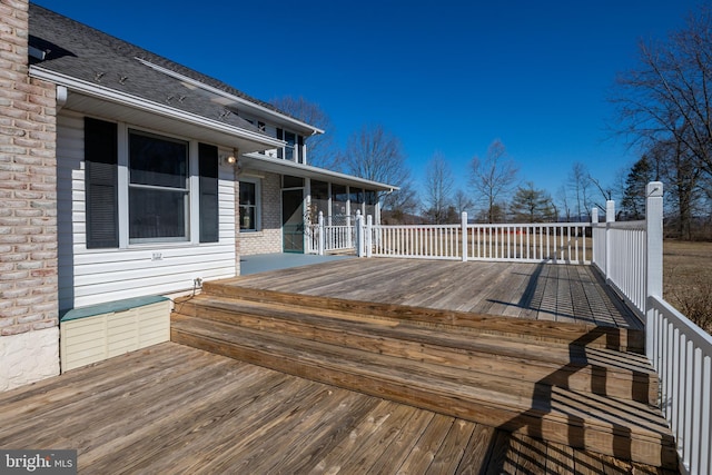 wooden terrace with a sunroom