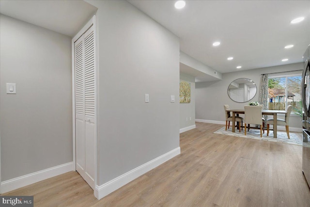 interior space with recessed lighting, baseboards, and light wood-style flooring