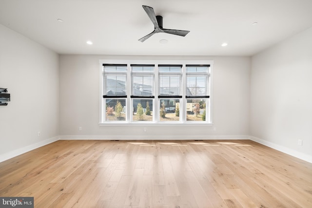 unfurnished room with recessed lighting, baseboards, light wood-style flooring, and a ceiling fan