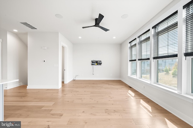 empty room with a ceiling fan, baseboards, visible vents, recessed lighting, and light wood-type flooring