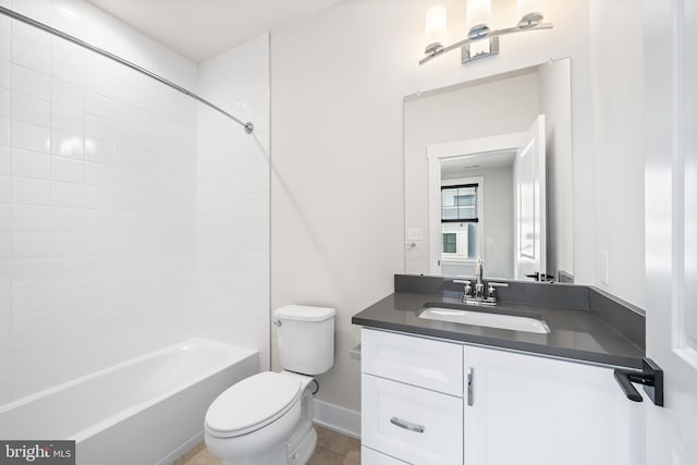 full bath with vanity, toilet, tub / shower combination, and baseboards