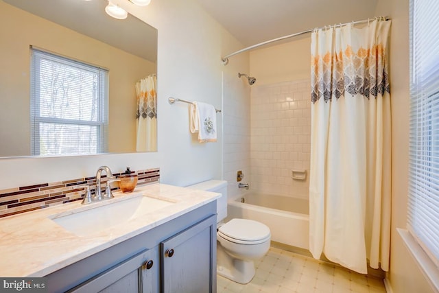 bathroom with tasteful backsplash, shower / bath combo with shower curtain, toilet, tile patterned floors, and vanity