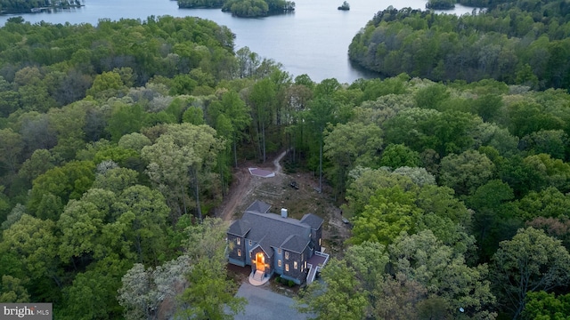 aerial view featuring a view of trees and a water view