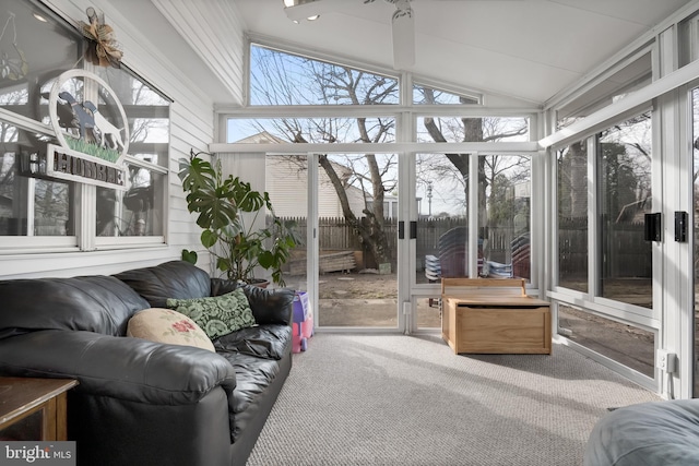 sunroom featuring a healthy amount of sunlight and lofted ceiling