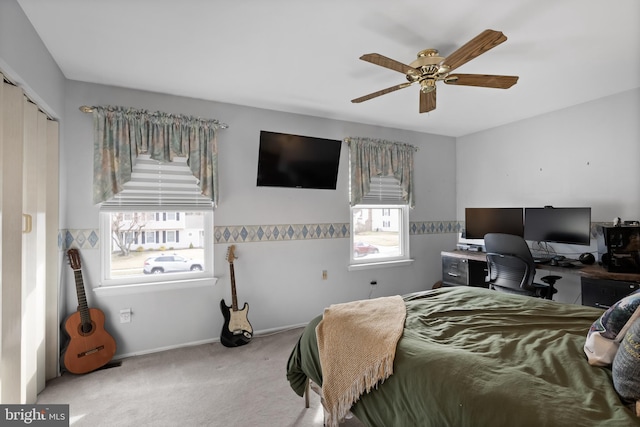 bedroom featuring carpet, baseboards, and ceiling fan