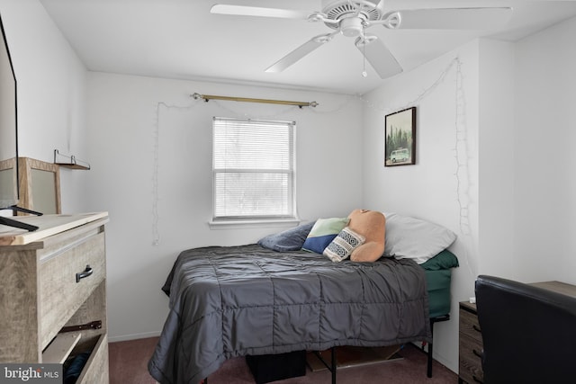 bedroom with a ceiling fan and carpet floors