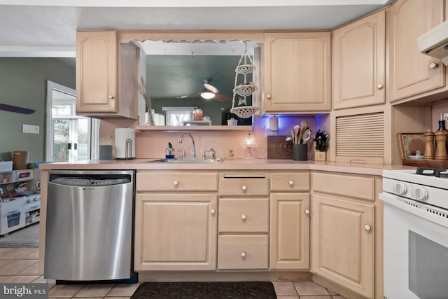 kitchen with a sink, stainless steel dishwasher, and light brown cabinets