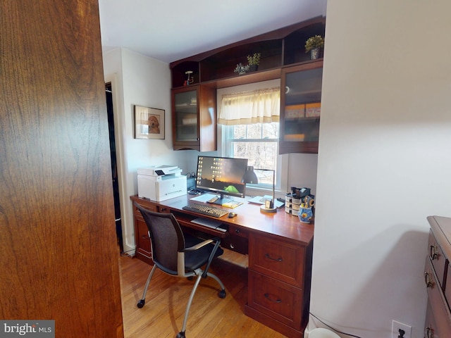 home office with light wood finished floors