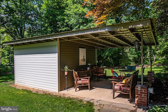 view of outbuilding with a pergola