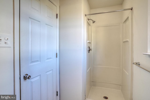 bathroom featuring a shower stall