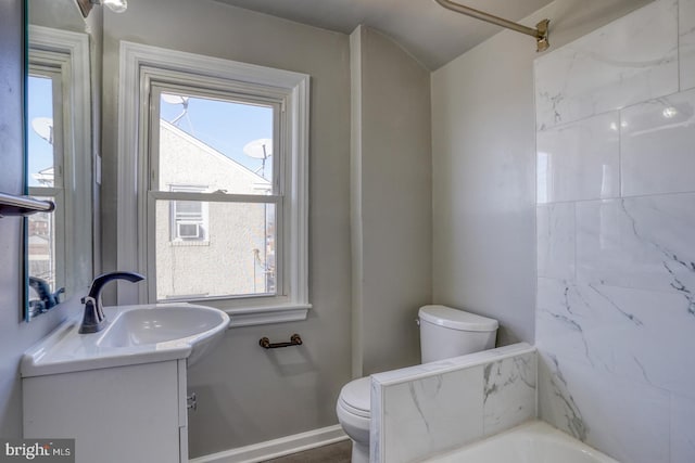 full bathroom with walk in shower, baseboards, toilet, a bathing tub, and vanity