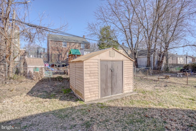 view of shed featuring a fenced backyard