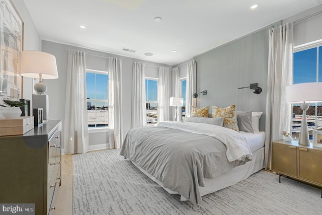 bedroom featuring access to outside, recessed lighting, visible vents, and light wood-type flooring