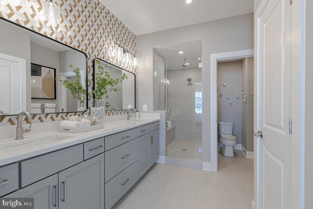 full bath featuring a shower stall, toilet, double vanity, and a sink