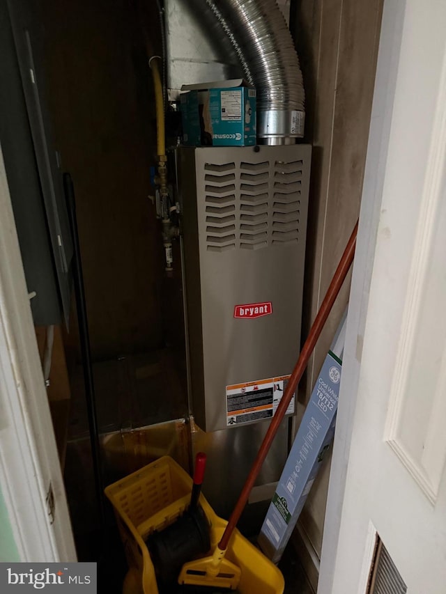 utility room featuring heating unit