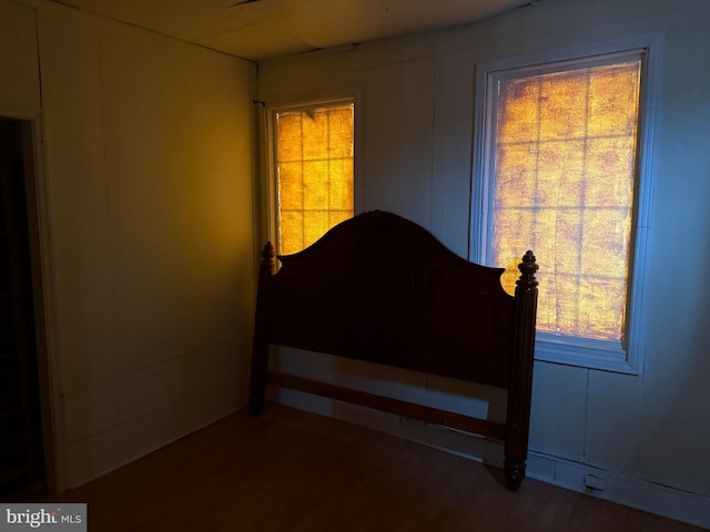 bedroom featuring wood finished floors