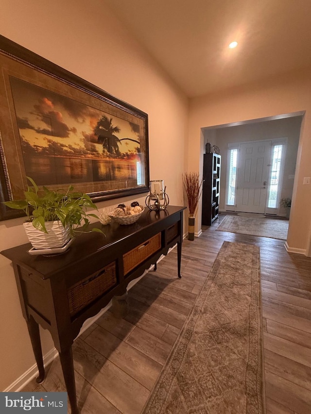 entrance foyer featuring recessed lighting, wood finished floors, and baseboards