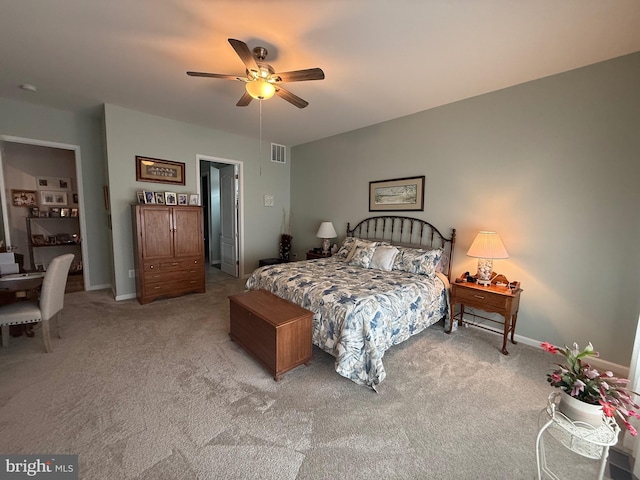 bedroom featuring visible vents, carpet floors, baseboards, and ceiling fan