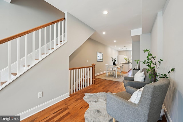 interior space with recessed lighting, baseboards, and wood finished floors