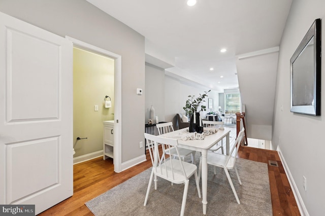 dining area with visible vents, recessed lighting, wood finished floors, and baseboards