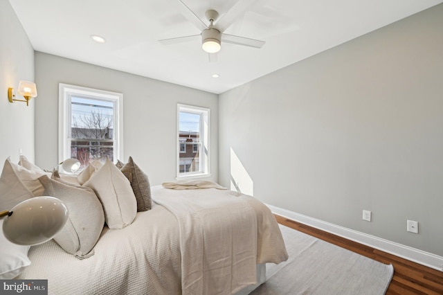 bedroom with recessed lighting, baseboards, and wood finished floors