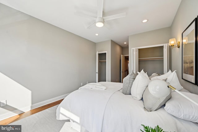 bedroom with a ceiling fan, recessed lighting, wood finished floors, and baseboards