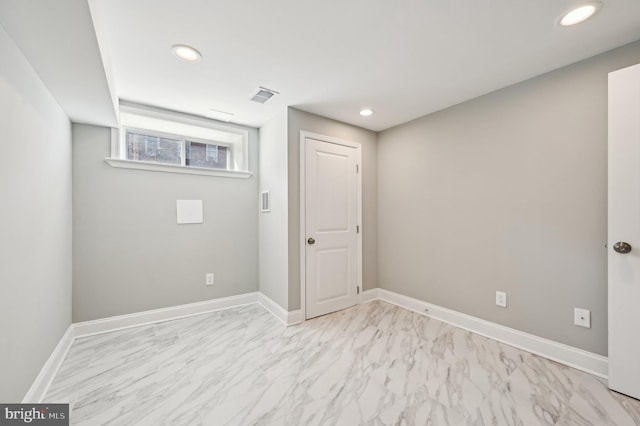 interior space featuring visible vents, recessed lighting, marble finish floor, and baseboards