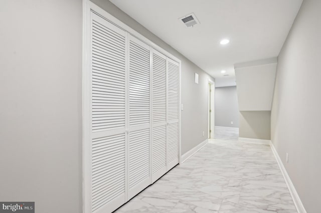 hall with recessed lighting, visible vents, marble finish floor, and baseboards