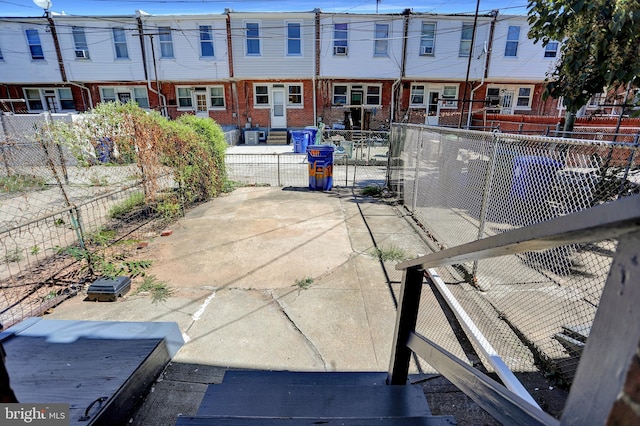 view of patio / terrace featuring fence