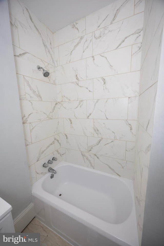 full bath with marble finish floor and shower / bathtub combination