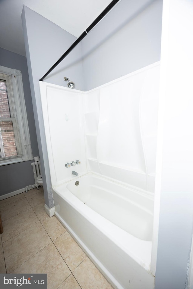 bathroom featuring tile patterned floors and shower / bathtub combination