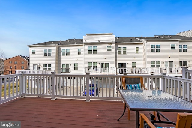 wooden deck featuring a residential view