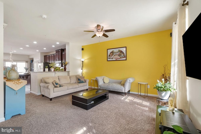 carpeted living room with recessed lighting, baseboards, and a ceiling fan