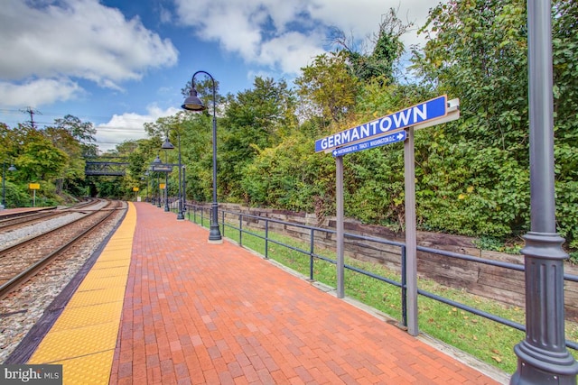 view of property's community featuring fence