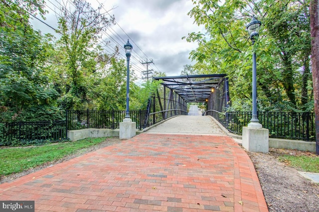 view of gate featuring fence