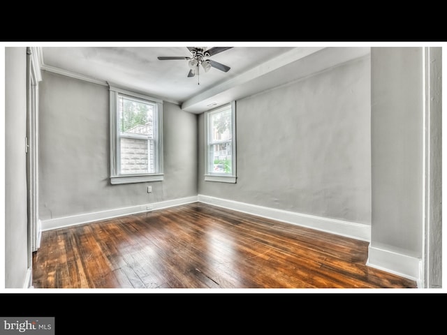 unfurnished room with baseboards, wood-type flooring, and ceiling fan