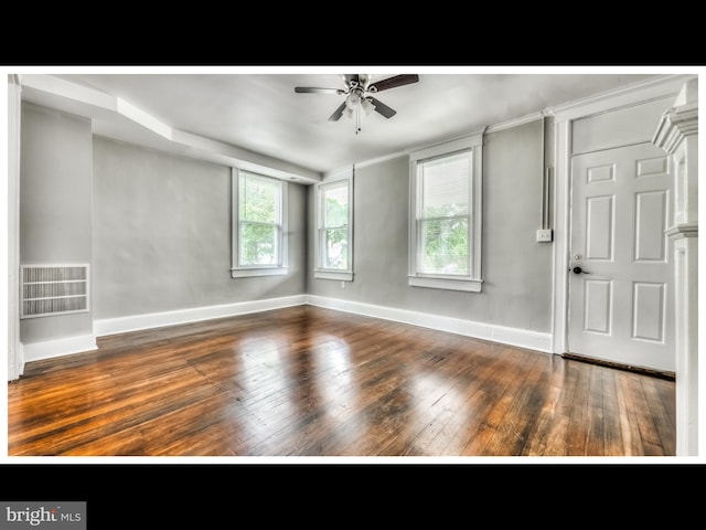 entryway featuring visible vents, baseboards, a ceiling fan, and hardwood / wood-style flooring