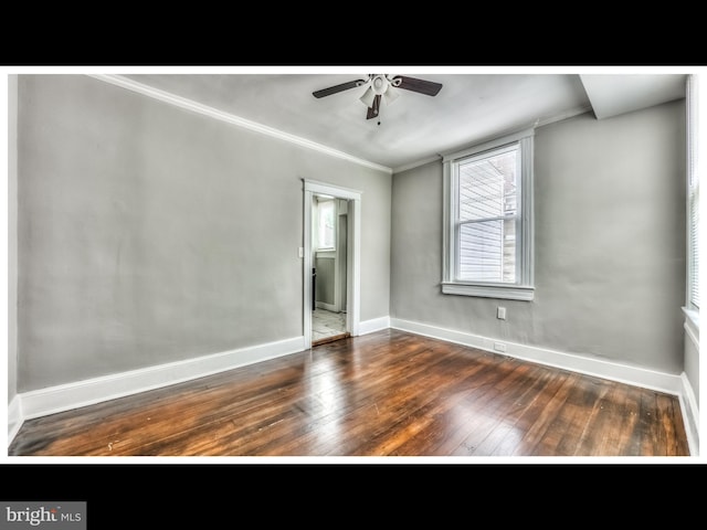 unfurnished room with hardwood / wood-style flooring, crown molding, baseboards, and ceiling fan