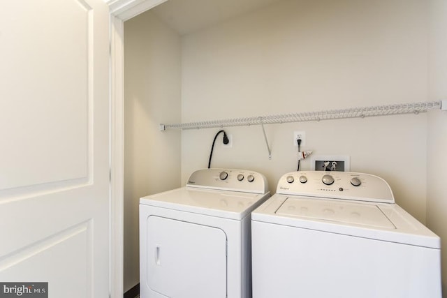 clothes washing area featuring washing machine and clothes dryer