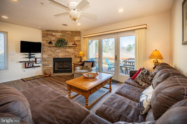 living room featuring wood finished floors, recessed lighting, french doors, a fireplace, and ceiling fan