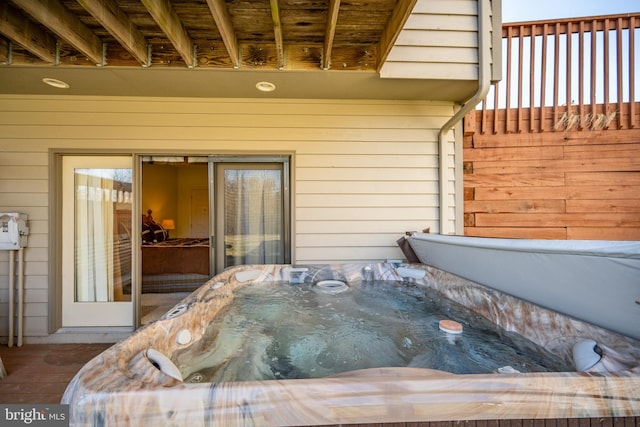 exterior space with a hot tub