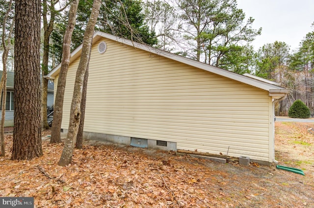 view of home's exterior with crawl space