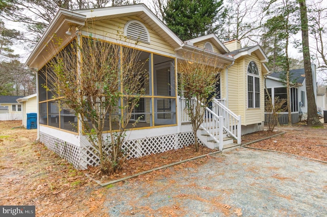 view of front facade with a sunroom