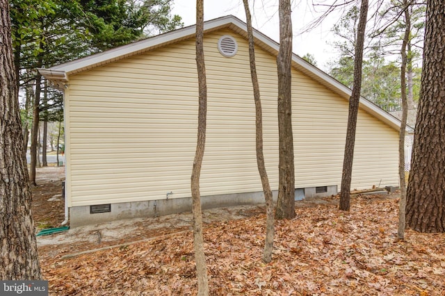 view of side of home with crawl space