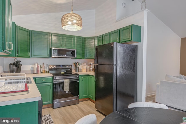 kitchen featuring green cabinets, stainless steel appliances, light countertops, and light wood-style floors