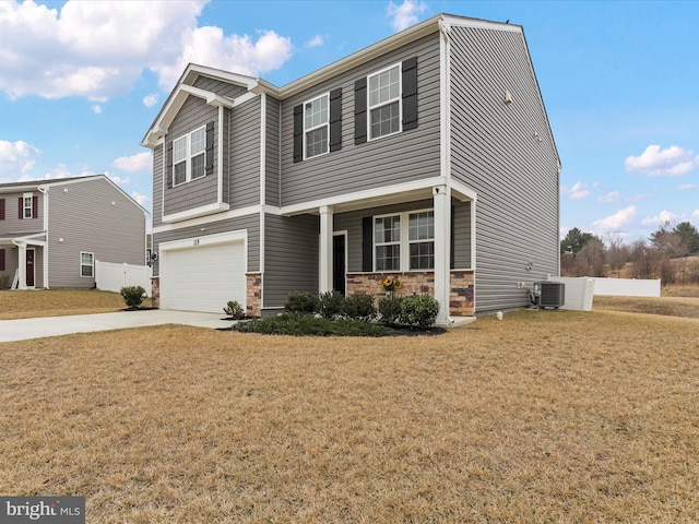 craftsman-style house featuring a front lawn, central air condition unit, driveway, stone siding, and an attached garage